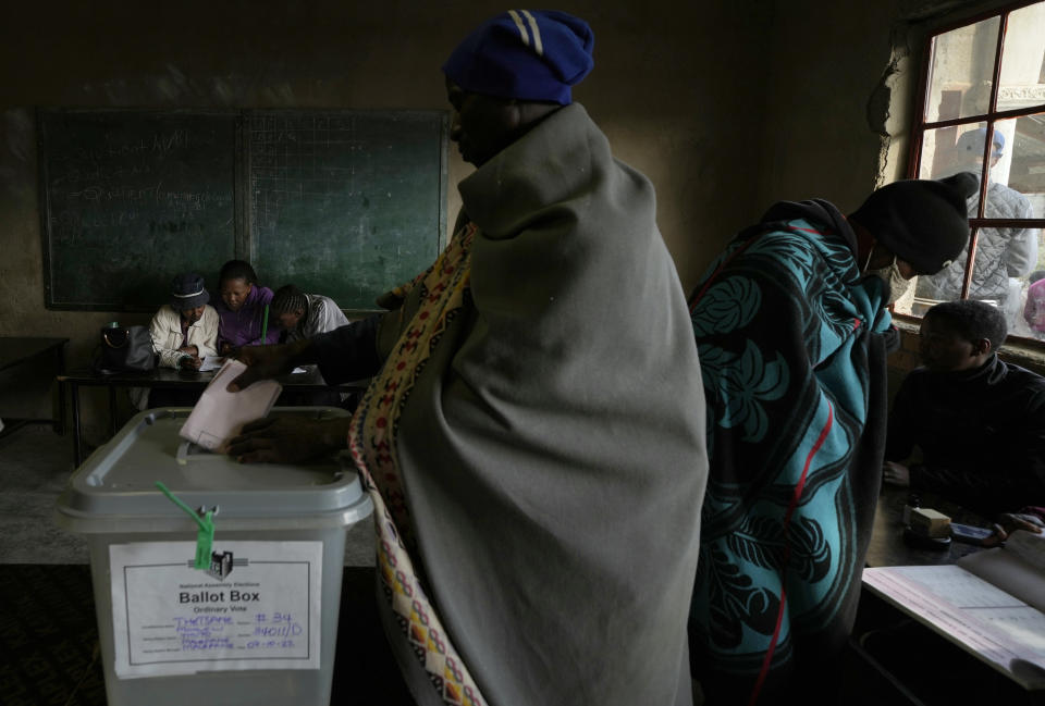 A man casts his vote at a poling station in Maseru, Lesotho, Friday, Oct. 7, 2022. Voters across the picturesque mountain kingdom of Lesotho are heading to the polls Friday to elect a leader to find solutions to high unemployment and crime. (AP Photo/Themba Hadebe)