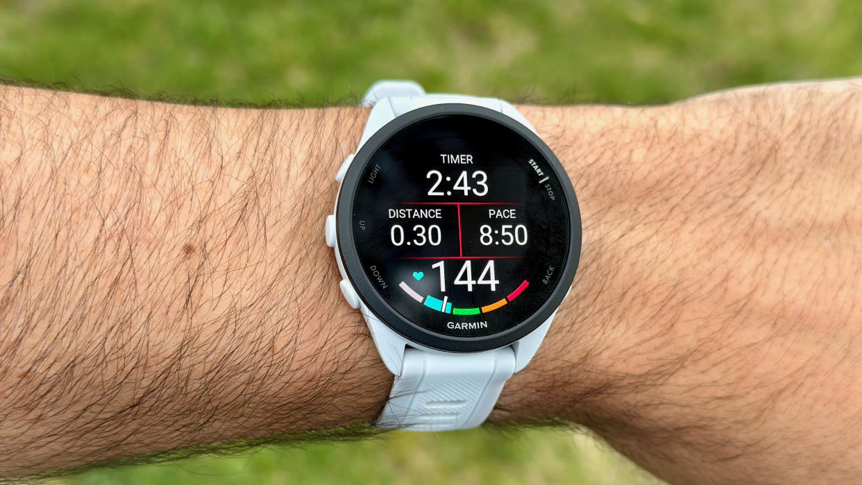  Close-up view of the Garmin Forerunner 165 during a run activity. 