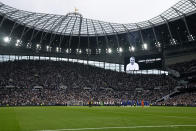 Players stand on the pitch applauding in a tribute to former player Jimmy Greaves before the English Premier League soccer match between Tottenham Hotspur and Chelsea at the Tottenham Hotspur Stadium in London, England, Sunday, Sep. 19, 2021. Greaves, one of England's greatest goal-scorers who was prolific for Tottenham, Chelsea and AC Milan has died. He was 81. Greaves was the all-time record scorer for Tottenham, which announced his death on Sunday. (AP Photo/Matt Dunham)