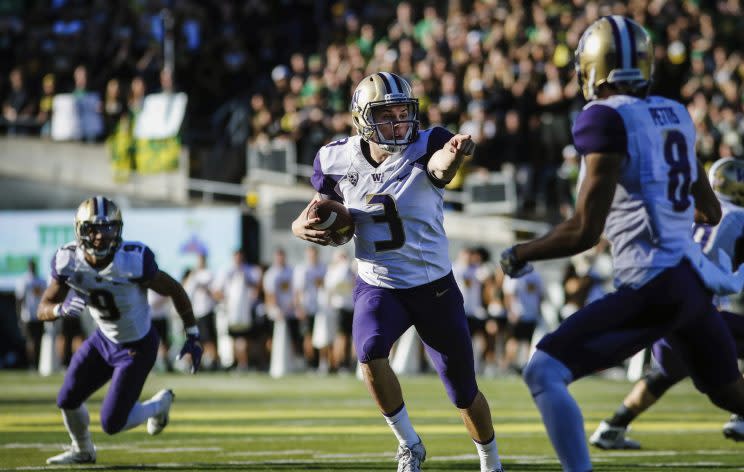 Washington quarterback Jake Browning (3), gives direction to a receiver against Oregon. (AP)