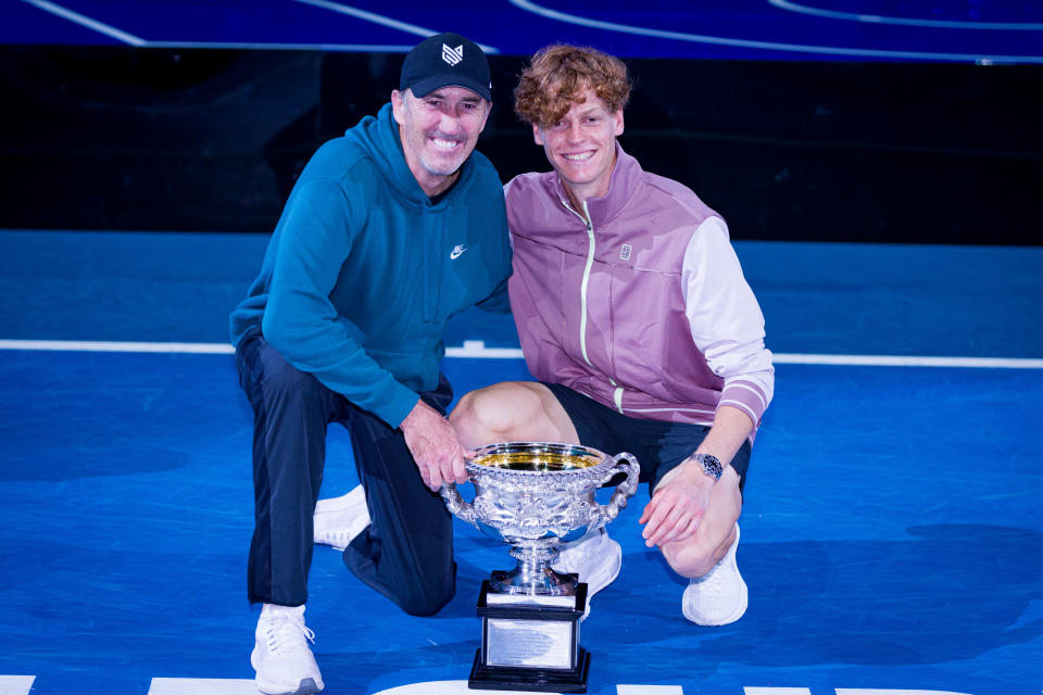 Jannik Sinner celebrates with coach Darren Cahill.