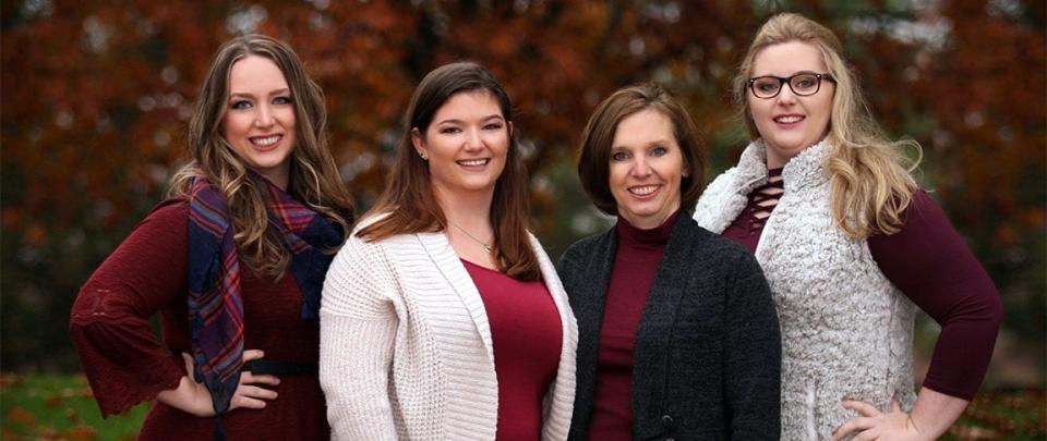 Lerynne West, second from right, and her daughters appear in an undated photo on the shuttered Callum Foundation website.