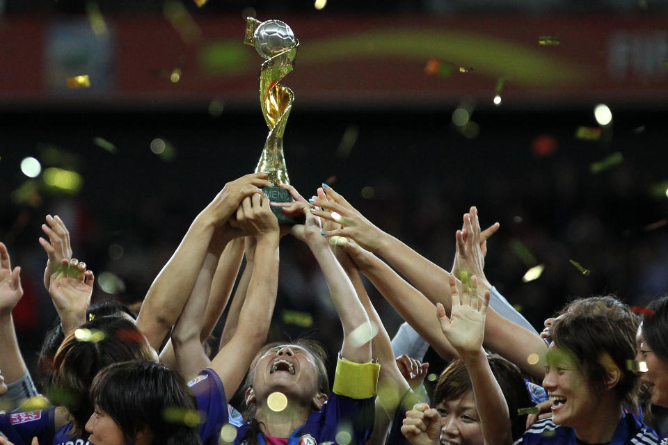 Homare Sawa lifts the World Cup for Japan at Germany 2011. (Photo by Sampics/Corbis via Getty Images)