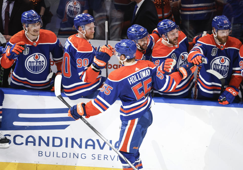 Edmonton Oilers' Dylan Holloway (55) is congratulated for his goal against the Florida Panthers during the first period of Game 4 of the NHL hockey Stanley Cup Final, Saturday, June 15, 2024, in Edmonton, Alberta. (Jeff McIntosh/The Canadian Press via AP)