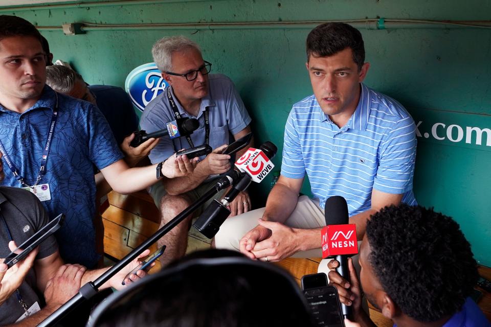 Chaim Bloom, Boston Red Sox chief baseball officer, talks with reporters in the dugout prior to a  game against Cleveland last Wednesday.