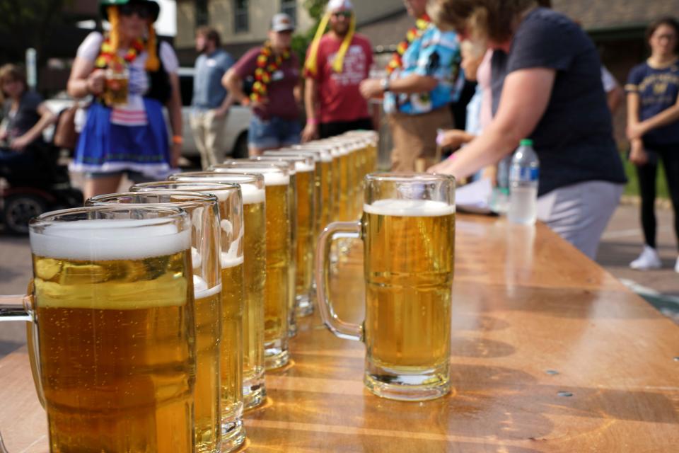 Steins full of beer are prepared for the stein holding compettition during Germanfest in Sioux Falls on Saturday, September 11, 2021.