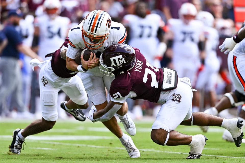 Texas A&M linebacker Taurean York, right, gets in on a tackle on Auburn quarterback Payton Thorne last season. York returns for a young but talented Aggie linebacking unit.