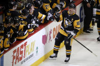 Pittsburgh Penguins' Sidney Crosby (87) returns to the bench after his goal during the third period of an NHL hockey game against the Minnesota Wild in Pittsburgh, Tuesday, Jan. 14, 2020. (AP Photo/Gene J. Puskar)