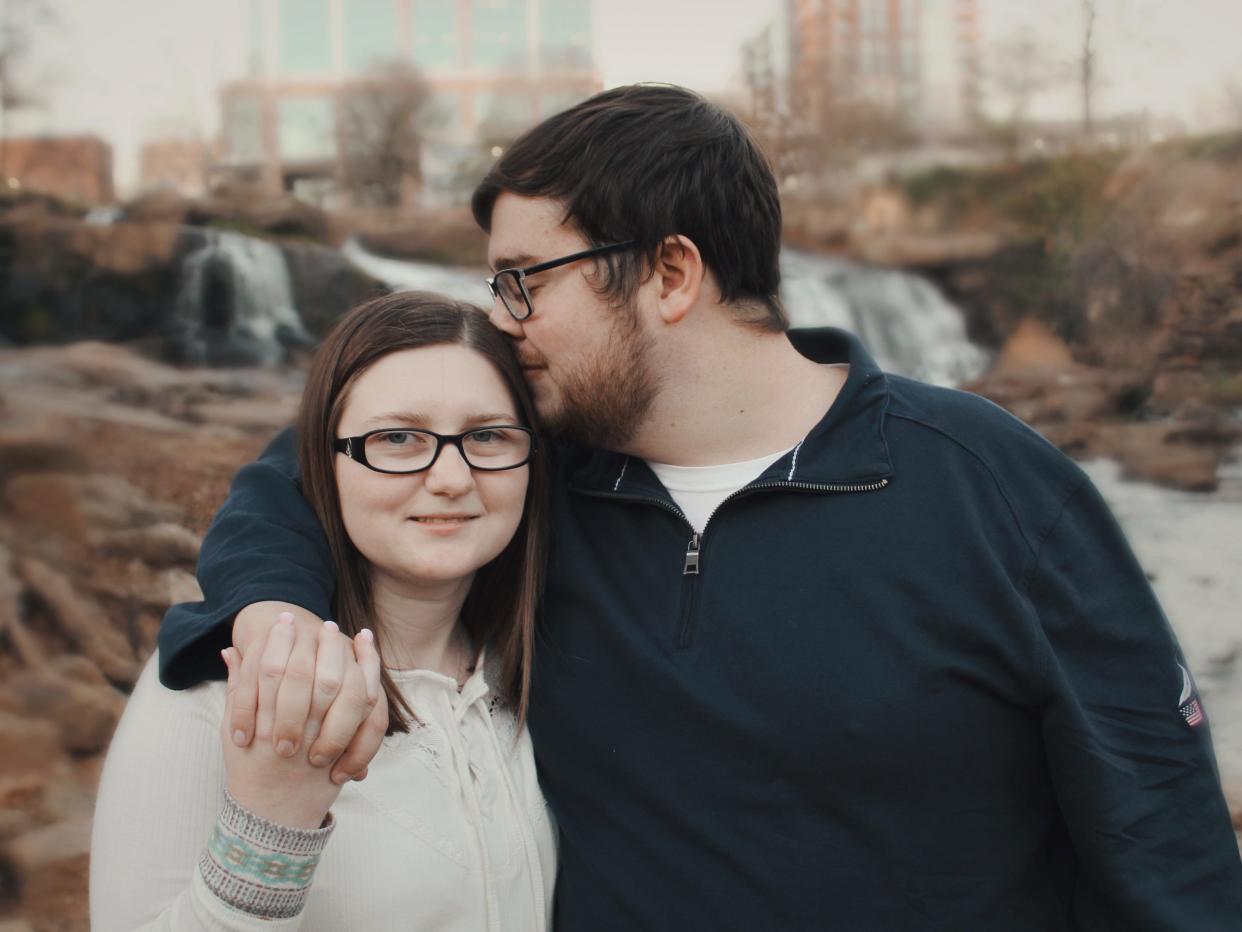 The writer poses with his fiancée