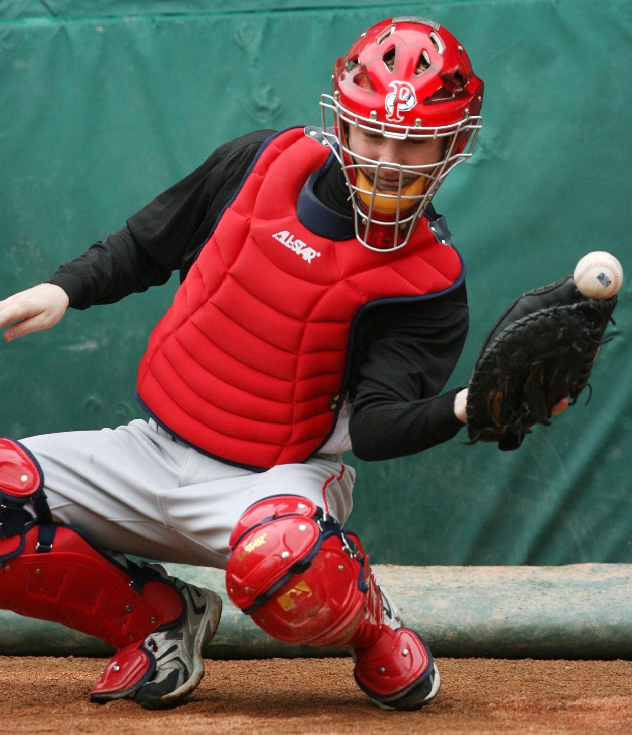 Joe McDonald attempts to catch a knuckleball thrown by PawSox pitcher Charlie Zink, who was mentored by Tim Wakefield back in 2006.