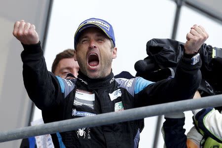 U.S. actor Patrick Dempsey reacts on the podium after taking second place with his Poshe 911 RSR in the LM GTE Am category during the Le Mans 24-hour sportscar race in Le Mans, central France June 14, 2015. REUTERS/Stephane Mahe