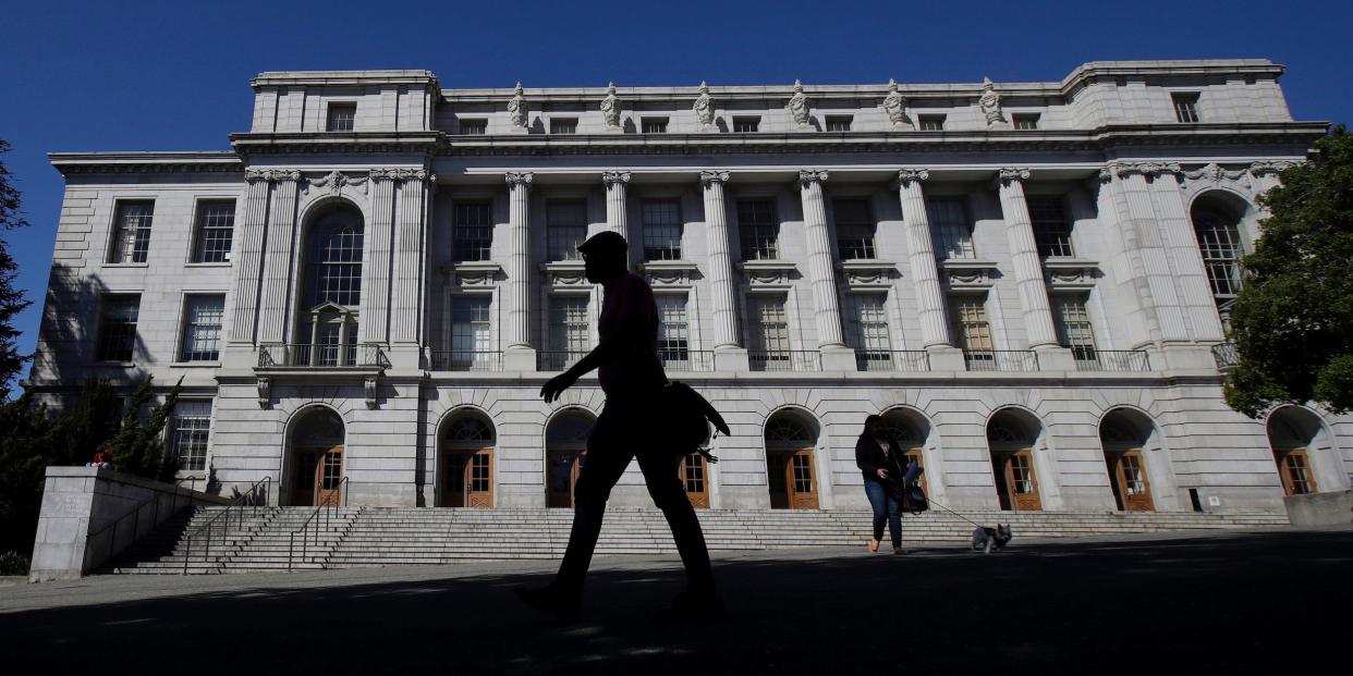 People walk in front of Wheeler Hall on the University of California campus in Berkeley, California.