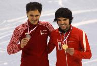 SHANGHAI, CHINA - DECEMBER 09: (L-R) Vladimir Grigorev of Russia (2nd Place) and Charles Hamelin (1st Place) of Canada pose after the medal ceremony of the Men's 500m Final during the day two of the ISU World Cup Short Track at the Oriental Sports Center on December 9, 2012 in Shanghai, China. (Photo by Hong Wu/Getty Images)