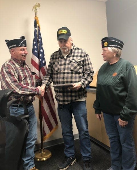 Denny Ross, left. and Tuscarawas County American Commander Linda Stefanov honor Patrick L. Walker as American Legion County Council Veteran of the Year for 2023.