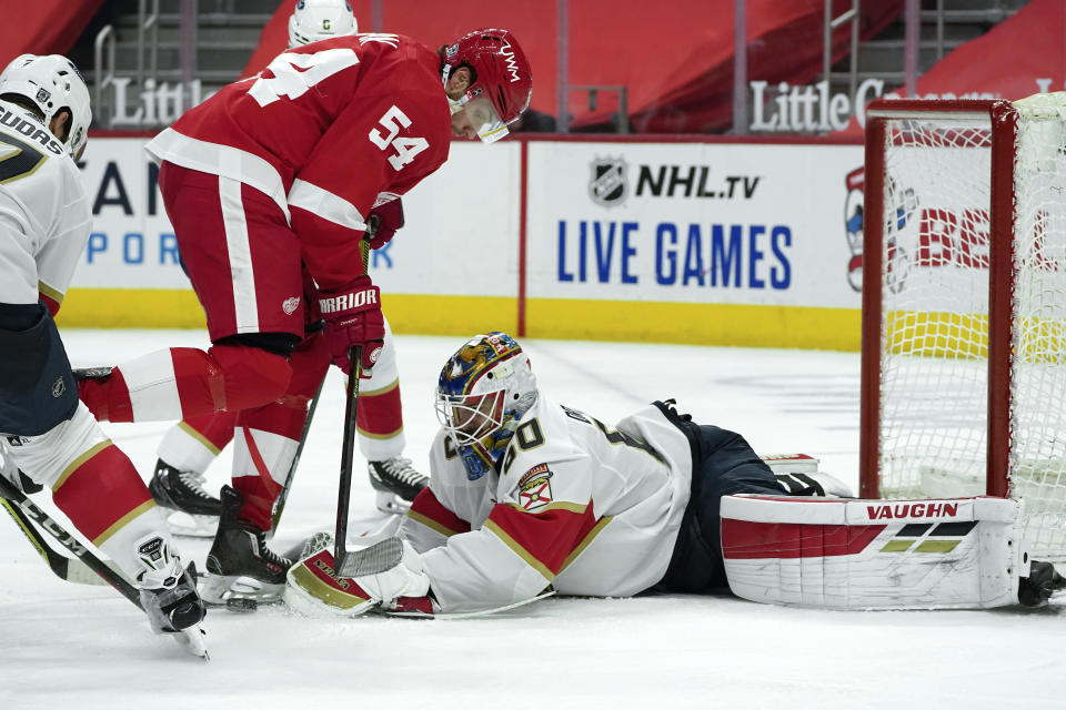 Florida Panthers goaltender Chris Driedger (60) stops a Detroit Red Wings right wing Bobby Ryan (54) shot in the second period of an NHL hockey game Sunday, Jan. 31, 2021, in Detroit. (AP Photo/Paul Sancya)