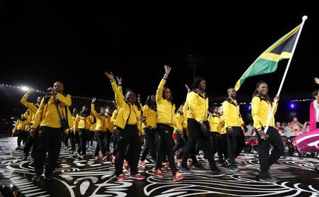 Gold Coast 2018 Commonwealth Games - Opening ceremony - Carrara Stadium - Gold Coast, Australia - April 4, 2018 - Alia Atkinson of Jamaica carries the national flag during the opening ceremony. REUTERS/Paul Childs