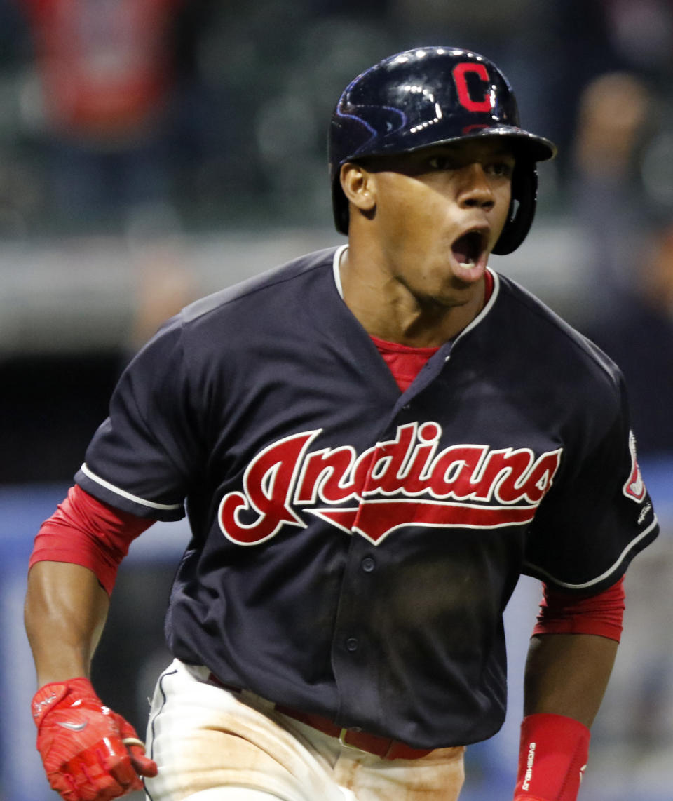 Cleveland Indians' Greg Allen celebrates as he runs to first on his game winning single in the eleventh inning of a baseball game against the Boston Red Sox, Sunday, Sept. 23, 2018, in Cleveland. Cleveland won 4-3. (AP Photo/Tom E. Puskar)