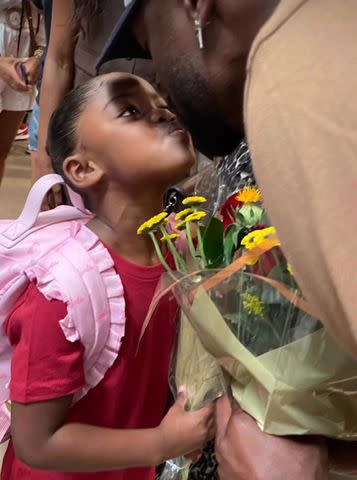 <p>Gabrielle Union-Wade/Instagram</p> Gabrielle Union and Dwyane Wade's daughter Kaavia shares a kiss with her dad after her dance recital.