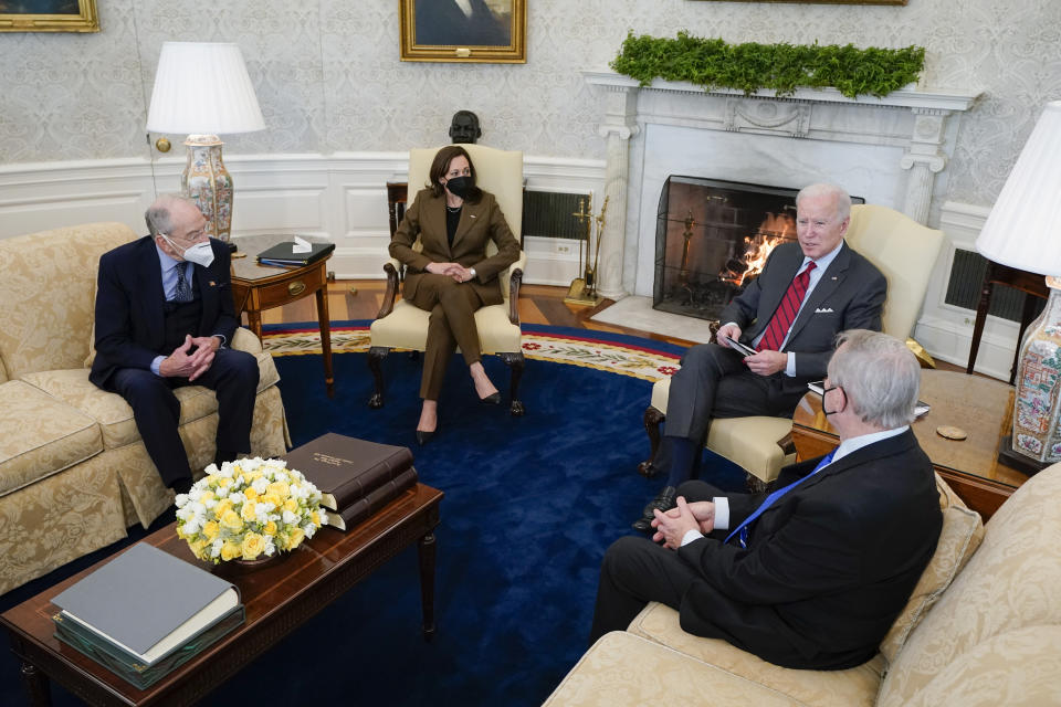 FILE - President Joe Biden and Vice President Kamala Harris meet with Sen. Dick Durbin, D-Ill., right, chairman of the Senate Judiciary Committee, and Sen. Chuck Grassley, R-Iowa, left, the ranking member, to discuss the upcoming Supreme Court vacancy in the Oval Office of the White House, Feb. 1, 2022, in Washington. Democrats control the 50-50 Senate because of Kamala Harris' tie-breaking vote. With Sen. Ben Ray Luján’s stroke, his party is outnumbered and can't approve bills or nominations without Republican support. Luján is 49 and Democrats say they expect him back in four to six weeks. (AP Photo/Patrick Semansky, File)