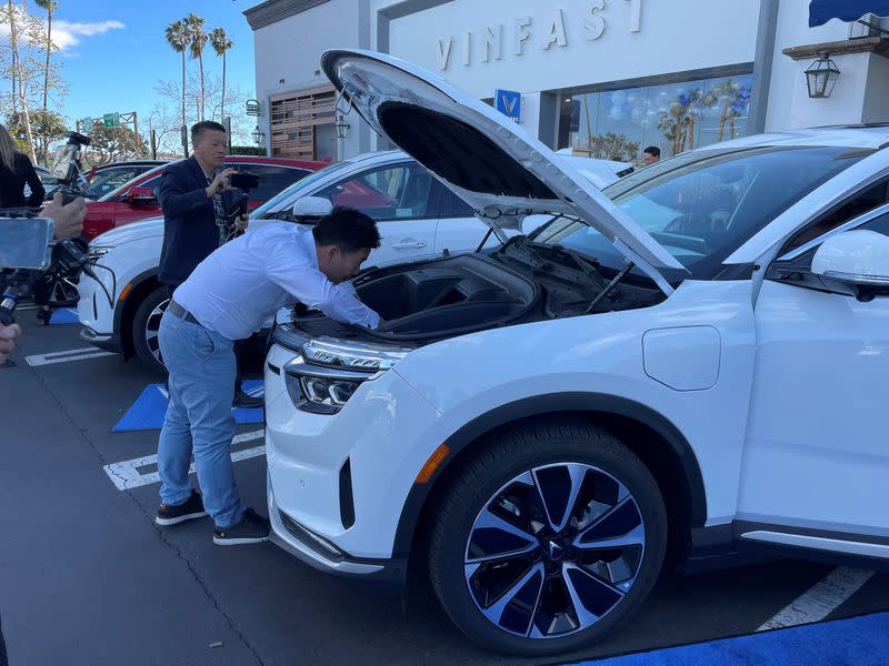 Buyer Andrew Le takes delivery of his new VinFast electric car in Los Angeles