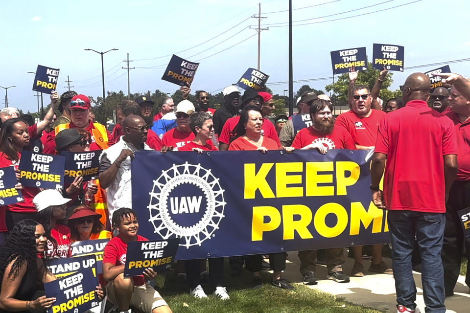 In this image from video, United Auto Workers members rally outside Stellantis' Sterling Heights Assembly Plant Friday, Aug. 23, 2024, in Sterling Heights, Mich. (AP Photo/Tom Krisher)