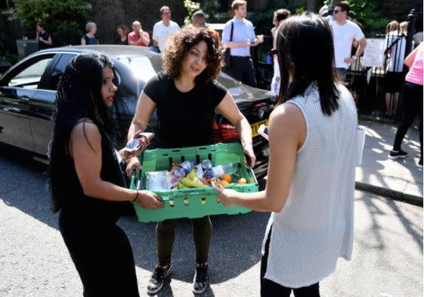 'Everybody was hands on': the local community comes together to provide emergency essentials. Photo: Yahoo UK