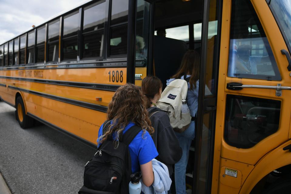 Students at Martin County High School wait in line while boarding bus 1808 parked in the school's bus loop at the end of the school day on Thursday, Oct. 20, 2023, in Stuart.