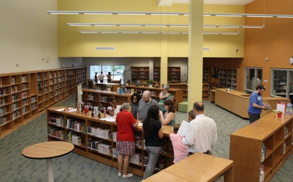 Students explore the newly completed Pine Hollow Middle School media center at the school’s open house on July 7, 2016.