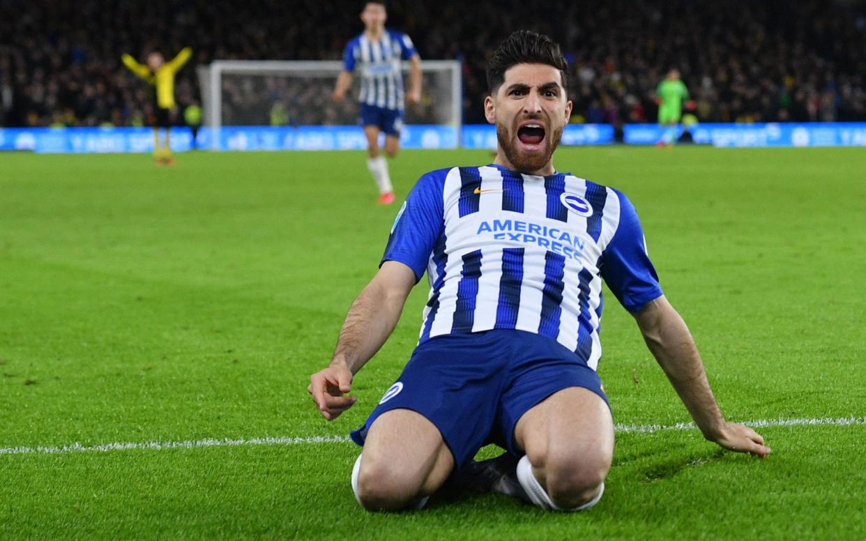 Brighton's Iranian midfielder Alireza Jahanbakhsh celebrates after Watford's English-born Jamaican defender Adrian Mariappa scores an own goal during the English Premier League football match between Brighton and Hove Albion and Watford - AFP