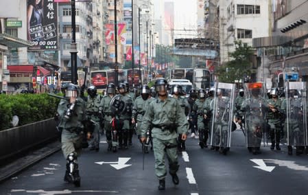 Police officers patrol the streets following demonstration march in protest against the invocation of the emergency laws in Hong Kong