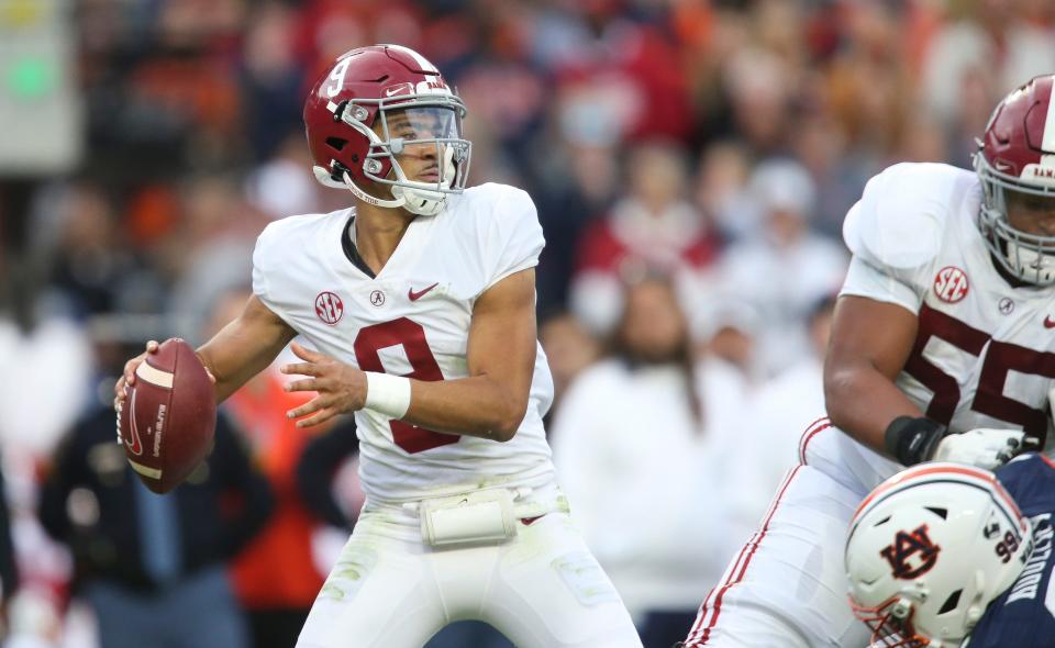 Alabama Crimson Tide quarterback Bryce Young (9) throws against the Auburn Tigers during the first half at Jordan-Hare Stadium.