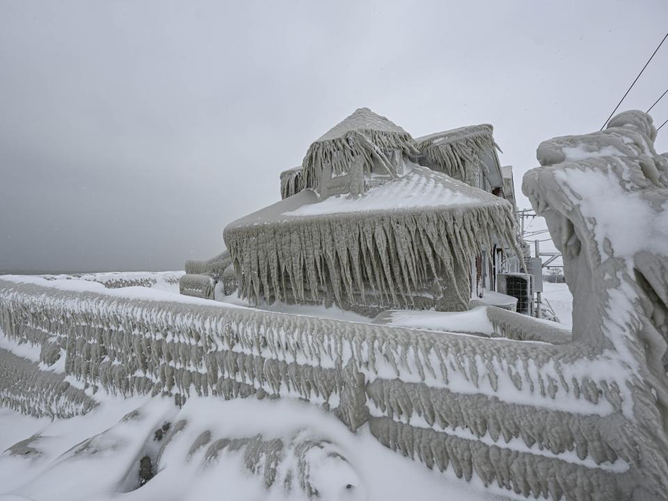 A house completely covered in ice is seen after snowfall as death toll in the snowstorm, which was effective, reached 26 in Buffalo, New York, United States on December 26, 2022.