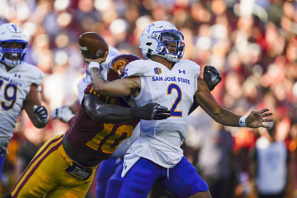 Southern California defensive end Jamil Muhammad tackles San Jose State quarterback Chevan Cordeiro (2) during the first half of an NCAA college football game Saturday, Aug. 26, 2023, in Los Angeles. (AP Photo/Ryan Sun)