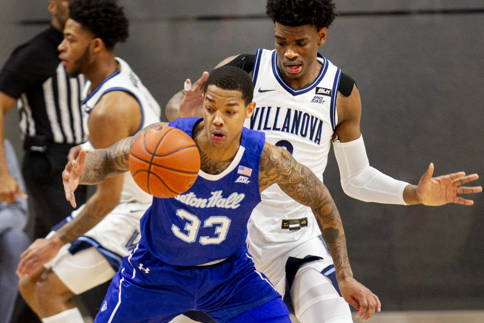 Seton Hall guard Shavar Reynolds (33) is fouled by Villanova forward Brandon Slater (3) during the first half of an NCAA college basketball game, Tuesday, Jan. 19, 2021, in Villanova, Pa. (AP Photo/Laurence Kesterson)