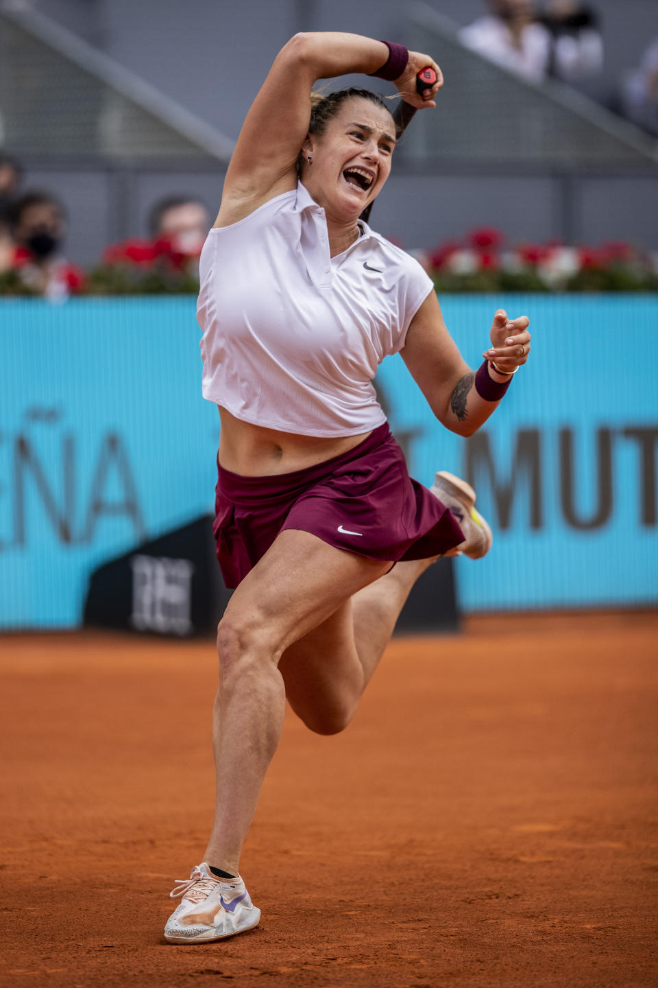 Aryna Sabalenka of Belarus returns the ball to Australia's Ashleigh Barty during their women's final match at the Mutua Madrid Open tennis tournament in Madrid, Spain, Saturday, May 8, 2021. (AP Photo/Bernat Armangue)