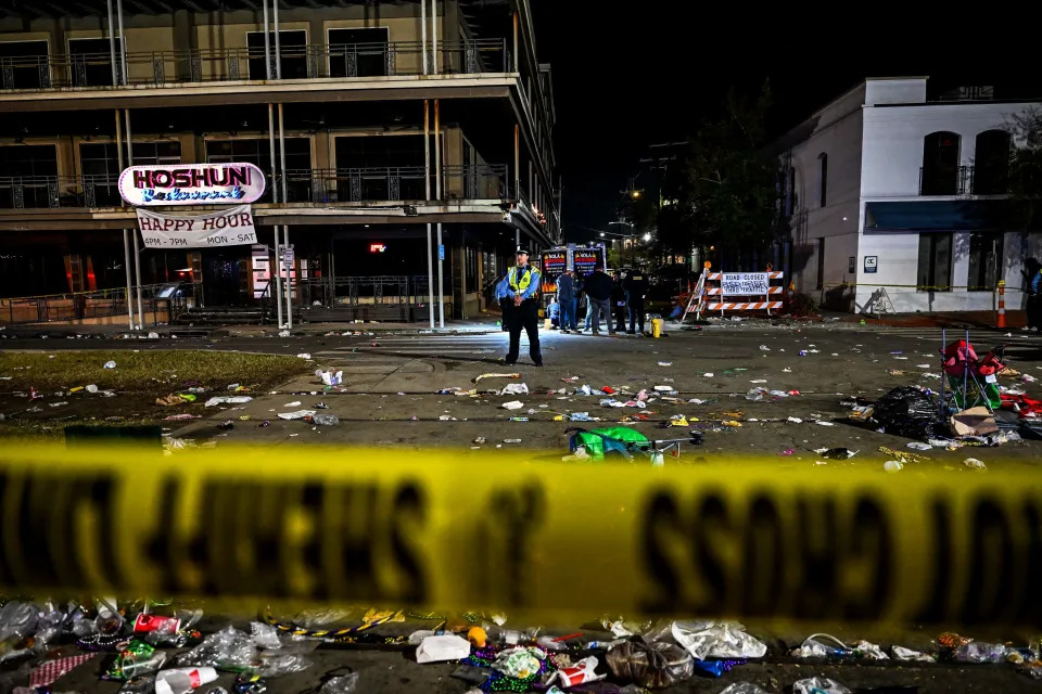 Police officers work at the scene of a shooting that occurred during the Krewe of Bacchus parade in New Orleans, February 19, 2023. - New Orleans Deputy Police Chief Hans Ganthier said five people were shot, including a young girl, all of whom were taken to the hospital.