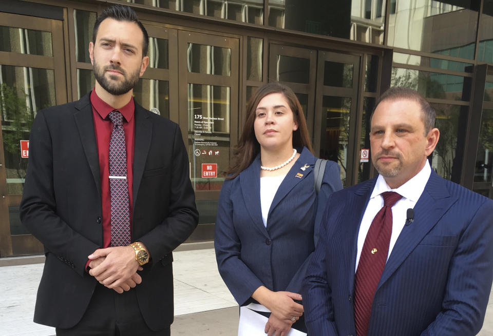 Tahnee Gonzales stands with her attorneys Marc Victor (right) and Andrew Marcantel outside the courthouse in downtown Phoenix on March 29, 2018. (Photo: Jacques Billeaud / ASSOCIATED PRESS)