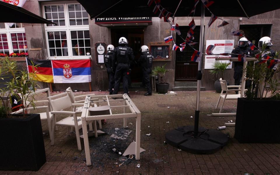 Glass tables shattered after fights broke out between fans (Reuters)