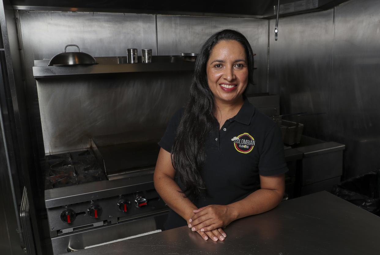 Erly Barajas poses for a portrait on Friday, August 9, 2024, at Colombian Flavors in De Pere, Wis. Barajas partnered with the owners of The Porch to provide food and bar service at 365 Main Ave., Suite D, in De Pere.