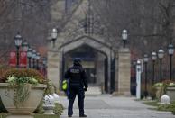 A member of the University of Chicago Police patrols the campus in Chicago, Illinois, United States, November 30, 2015. The University canceled Monday classes and activities after being warned by the FBI that someone had made an online threat of gun violence on campus, university President Robert J. Zimmer announced on Sunday. (REUTERS/Jim Young)