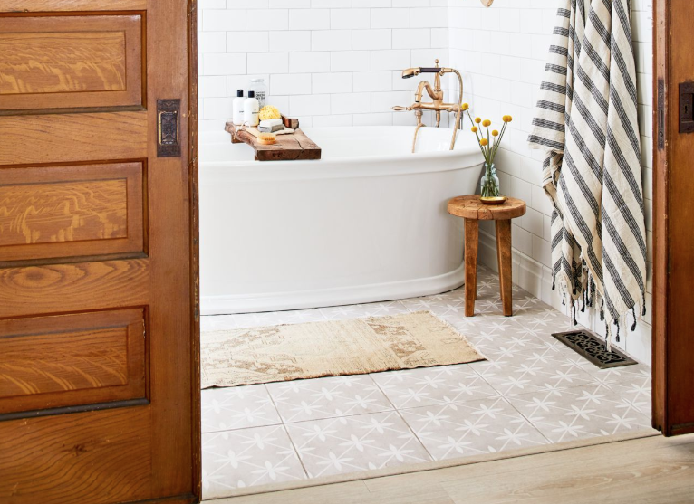 <p>Your bathroom can be big or small, colorful or quiet—but one thing it always should be is deeply relaxing. After all, it's more than just a room; it's the place to which you escape to prepare for the day and unwind when it's done in your favorite <a href="https://www.countryliving.com/home-design/g4654/cozy-chairs/" rel="nofollow noopener" target="_blank" data-ylk="slk:cozy chair;elm:context_link;itc:0;sec:content-canvas" class="link ">cozy chair</a>. So why not design it carefully, thoughtfully, and with well-considered details? We're here with a ton of bathroom tile ideas to help you get started, plus related <a href="https://www.countryliving.com/home-design/decorating-ideas/advice/g1369/bathroom-decorating-design-ideas/" rel="nofollow noopener" target="_blank" data-ylk="slk:bathroom decorating ideas;elm:context_link;itc:0;sec:content-canvas" class="link ">bathroom decorating ideas</a> that'll keep your space looking gorgeous from top to bottom. </p><p>From finishes that'll make your guests believe they've just arrived to a luxurious spa to simpler, more classic marble designs, there's something here for every taste and every decor style. Choose from timeless, tried-and-true tiles (such as subway!) and trendier, more <em>en vogue</em> patterns for <a href="https://www.countryliving.com/home-design/decorating-ideas/advice/g664/rustic-bathroom-design/" rel="nofollow noopener" target="_blank" data-ylk="slk:rustic bathrooms;elm:context_link;itc:0;sec:content-canvas" class="link ">rustic bathrooms</a> and <a href="https://www.countryliving.com/uk/homes-interiors/interiors/g27507449/country-bathroom-ideas/" rel="nofollow noopener" target="_blank" data-ylk="slk:country bathrooms;elm:context_link;itc:0;sec:content-canvas" class="link ">country bathrooms</a> (like herringbone or even the much talked-about "fish scale"), or opt for something completely out of the box, like a large-scale, totally artistic geometric pattern. These tile ideas aren't just for floors either; try them on walls, in showers, and even, yes, ceilings. Of course, there's no use just staring at a bunch of tile designs in a vacuum. The best designers know they've got to see each decor element within actual, lived-in spaces...which is why we've made sure to include 50 real rooms here for you to check out. </p>