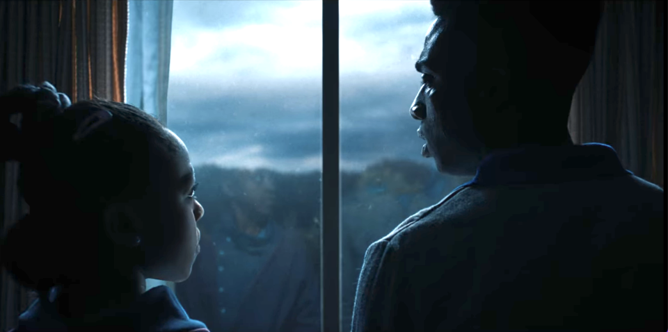 Erica and Lucas standing at a window and looking at each other