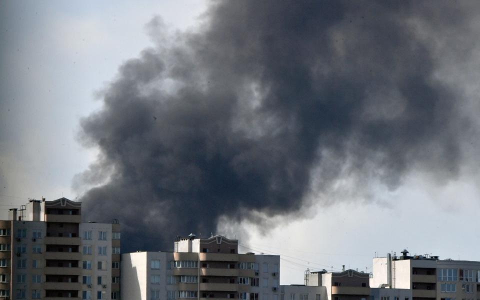 Explosions rang out and black smoke could be seen rising from the centre of Kyiv,