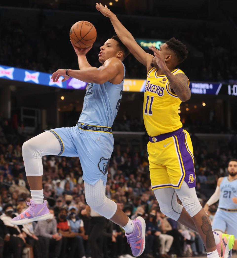 Memphis Grizzlies guard Desmond Bane drives past Los Angeles Lakers guard Malik Monk at FedExForum on Wednesday, Dec. 29, 2021.