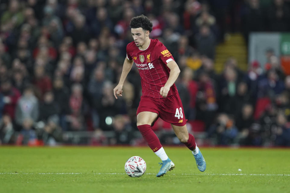 Liverpool's Curtis Jones controls the ball during the English FA Cup third round soccer match between Liverpool and Everton at Anfield stadium in Liverpool, England, Sunday, Jan. 5, 2020. (AP Photo/Jon Super)