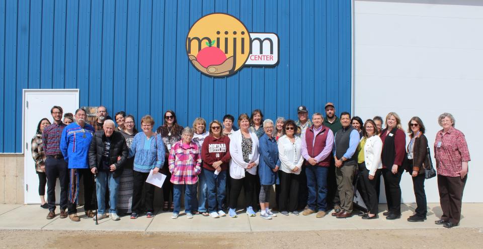 Tribal members, government dignitaries and honored guests assemble at the Little Shell Tribe's new food distribution warehouse on Thursday