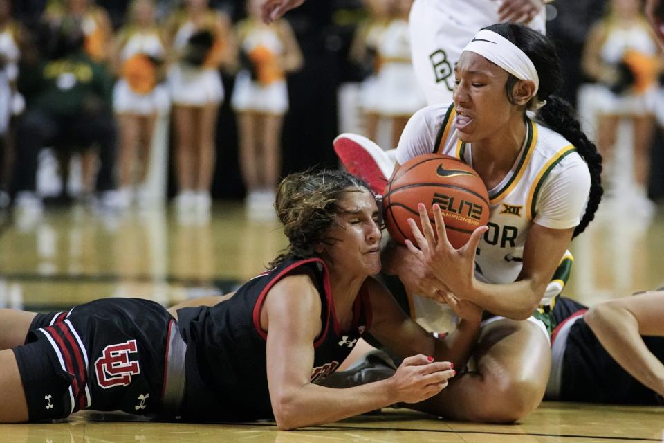 Baylor’s Darianna Littlepage-Buggs, right, and Utah’s Ines Vieira compete for a loose ball during the second half of an NCAA college basketball game, Tuesday, Nov. 14, 2023, in Waco, Texas. Baylor won 84-77. | Julio Cortez, Associated Press