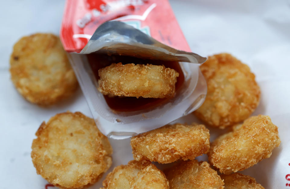 A Chick-fil-A hash brown sits in a packet of Heinz ketchup on April 12, 2021 in Novato, CA. (Justin Sullivan / Getty Images)