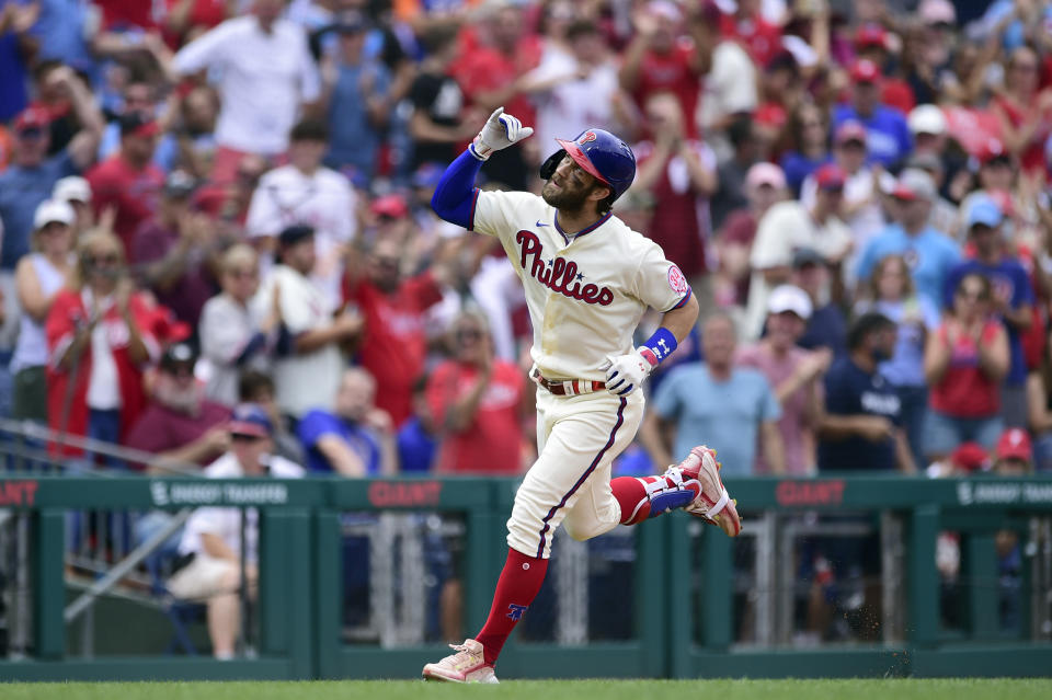 Philadelphia Phillies' Bryce Harper looks to the sky after hitting a solo home run off New York Mets starting pitcher Taijuan Walker during the sixth inning of a baseball game, Sunday, Aug. 8, 2021, in Philadelphia. (AP Photo/Derik Hamilton)