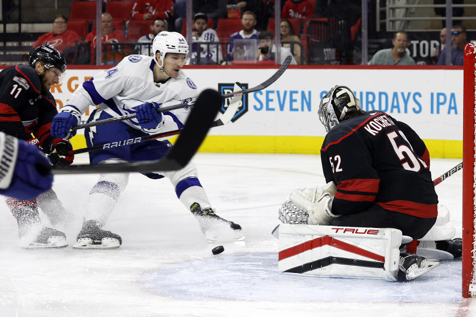 Tampa Bay Lightning's Tanner (84) shoots at Carolina Hurricanes goaltender Pyotr Kochetkov (52) during the first period of an NHL hockey game in Raleigh, N.C., Tuesday, March 28, 2023. (AP Photo/Karl B DeBlaker)